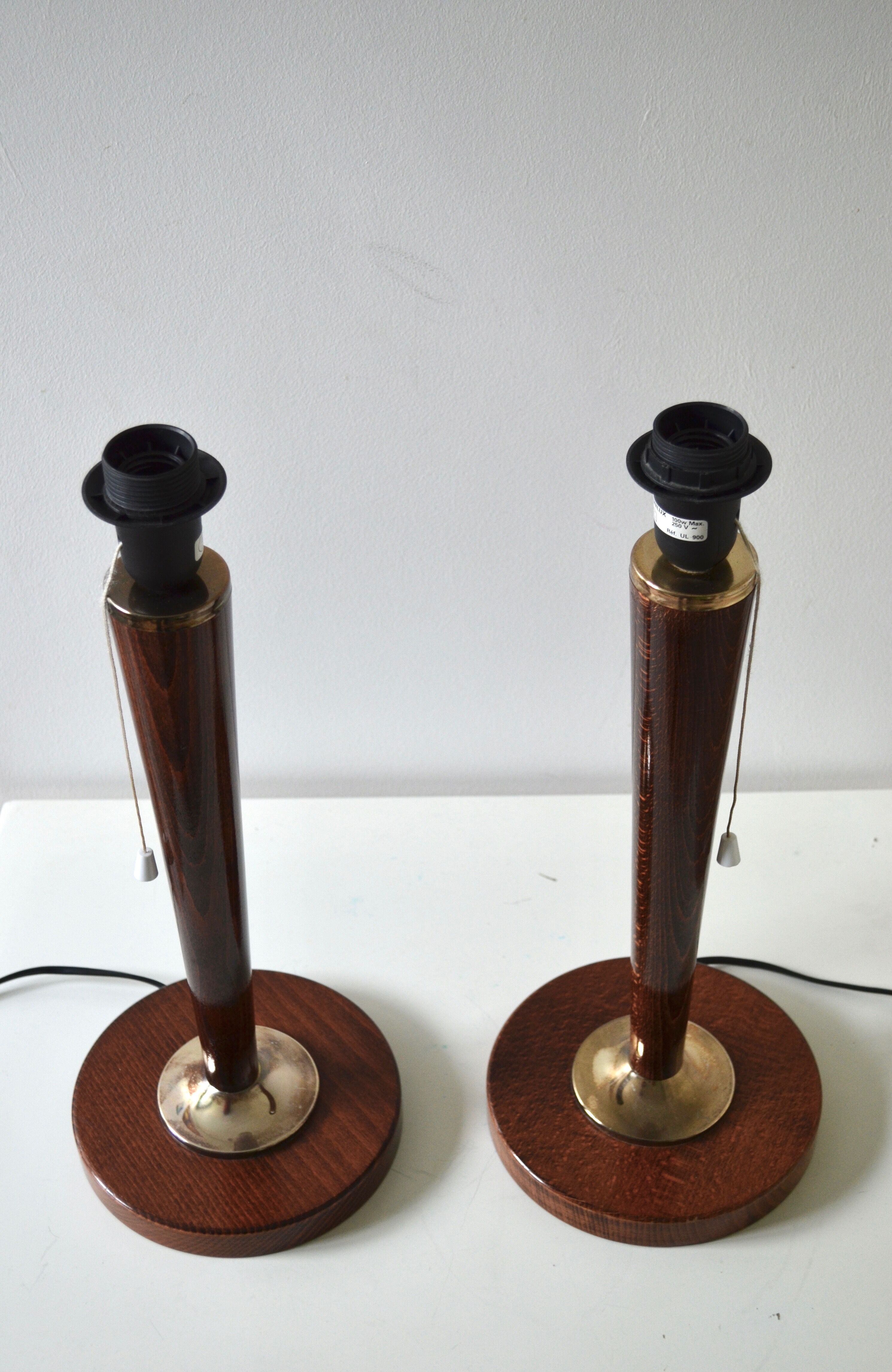 Pair of feet of Mazda-style UNILUX lamps.
