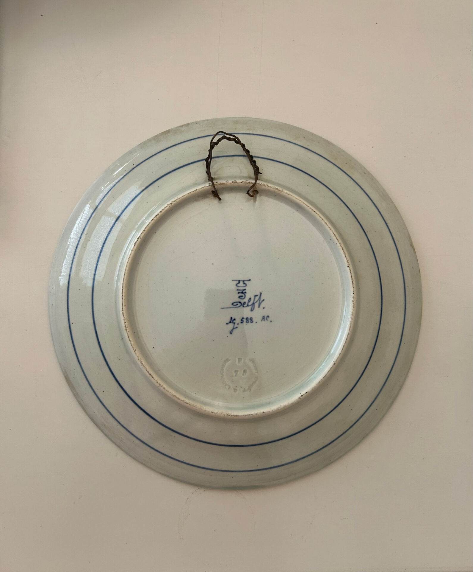 Old wall plate in blue Delft pottery
