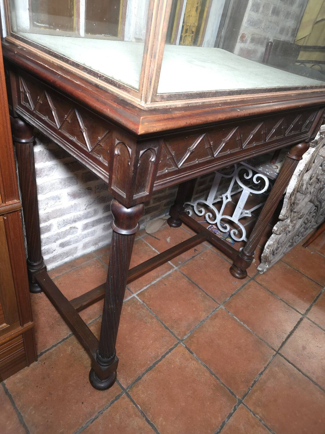 Antique display cabinet in 19th-century Gothic Revival style.