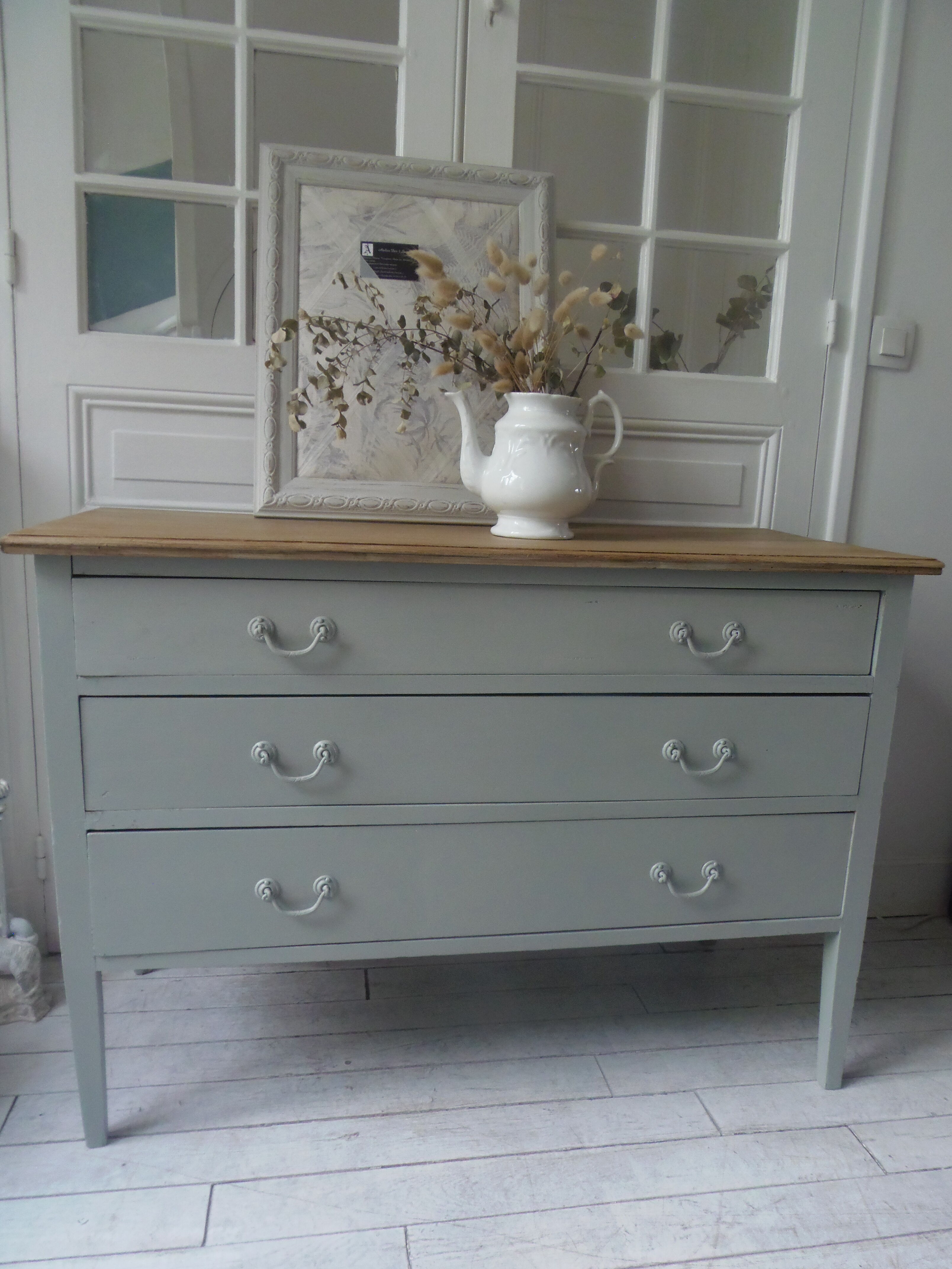 Green green vintage chest of drawers of gray, wood top.