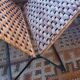 Folding magazine rack in metal and vintage woven wicker