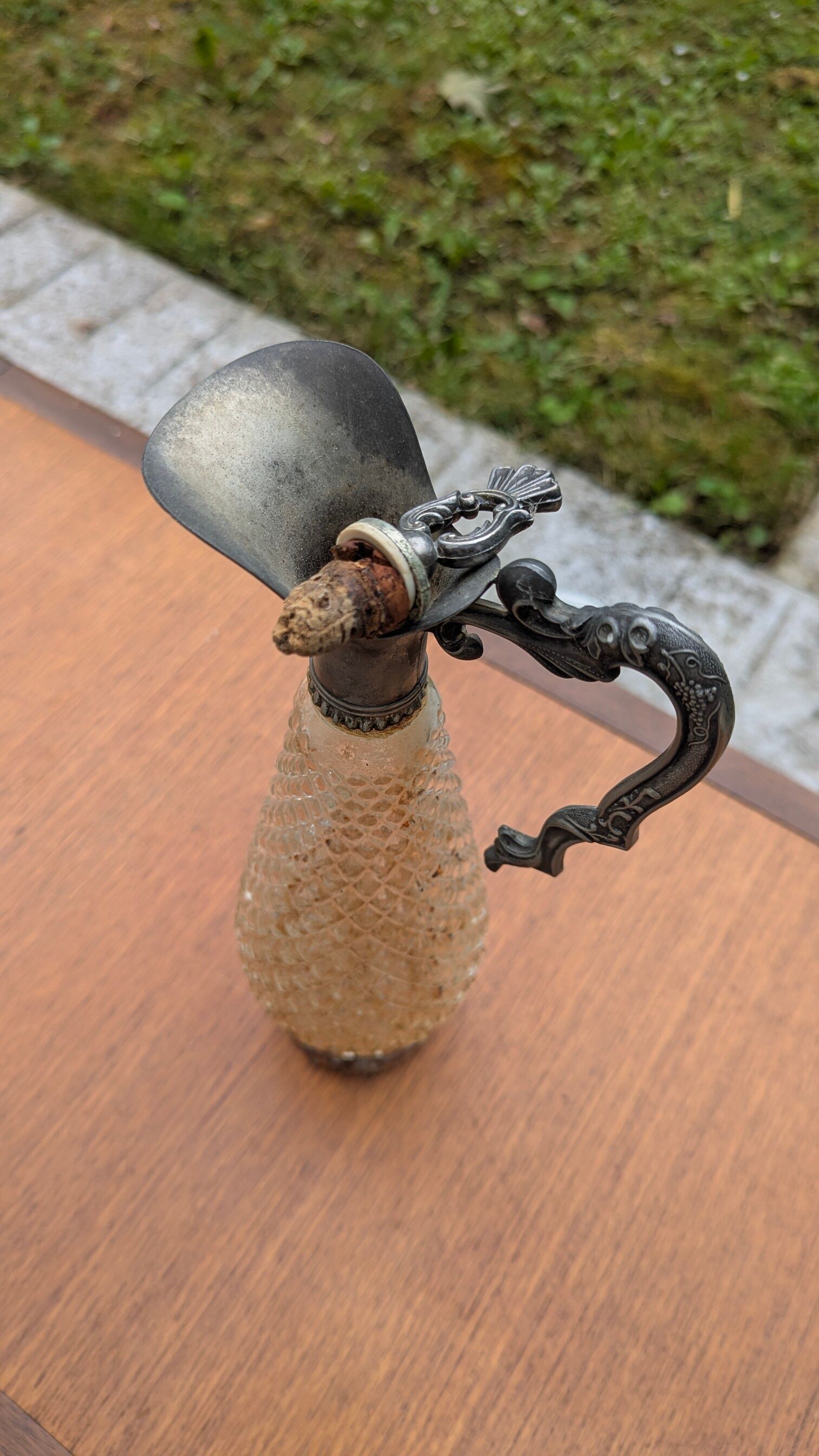 Old small carafe / liqueur jug in cut glass and silver metal.