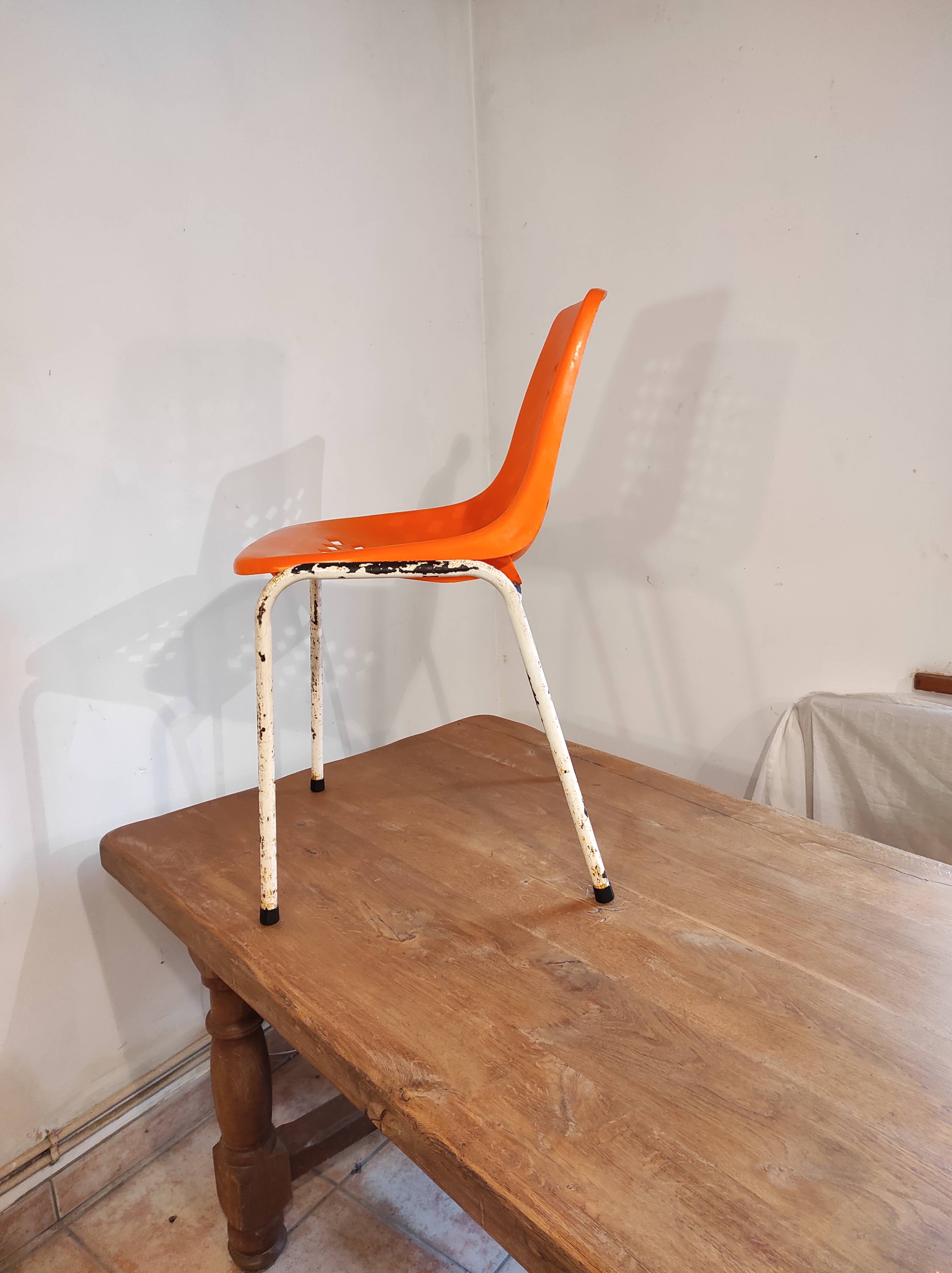 Chair with openwork plastic shell 1970