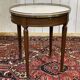 Louis XVI style bouillotte table from the 1960s in mahogany with a marble top.