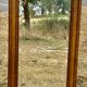 Large and old bevelled framed floor mirror.