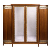 Grande armoire bibliothèque époque Art Déco en acajou et bronze