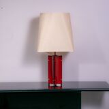 Red metal sculptural table lamp with oversized lamp shade circa 1980