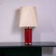 Red metal sculptural table lamp with oversized lamp shade circa 1980