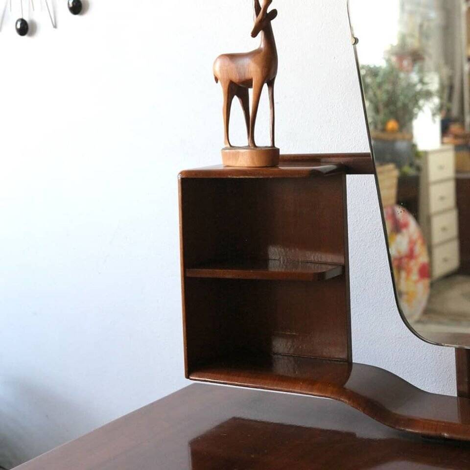 Vintage 1950s brown wooden dressing table with a double mirror and integrated storage.
