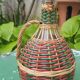 Glass and rattan carafe