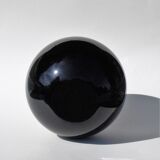 Old lamp foot shaped ball in black glass