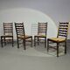 Ensemble de 4 chaises de salle à manger en chêne, rustiques, de ferme, à dossier en échelle avec sièges en jonc, années 1960