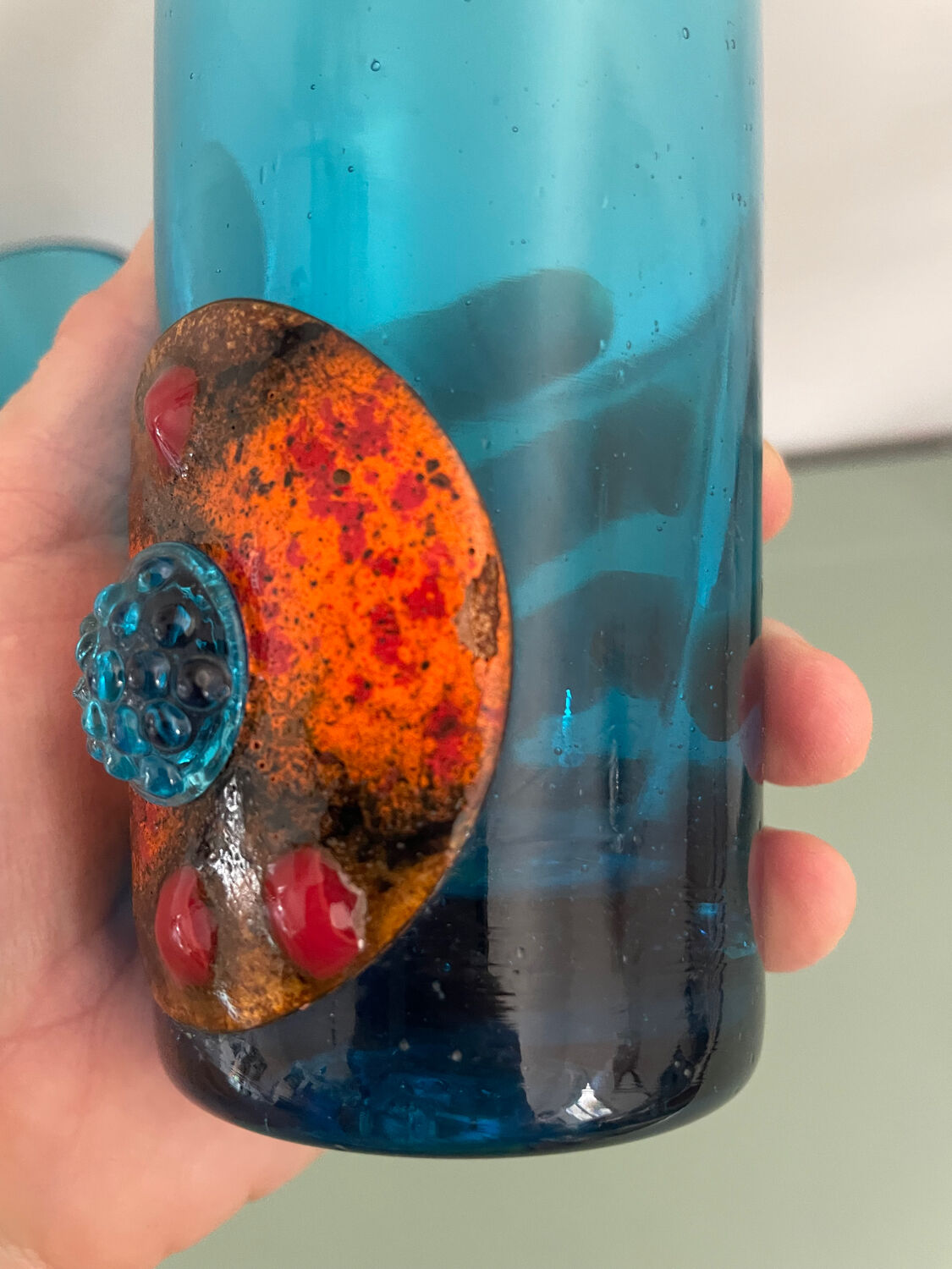 Six blue blown glass and enamel on copper glasses.