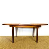 Oval teak dining table with extension