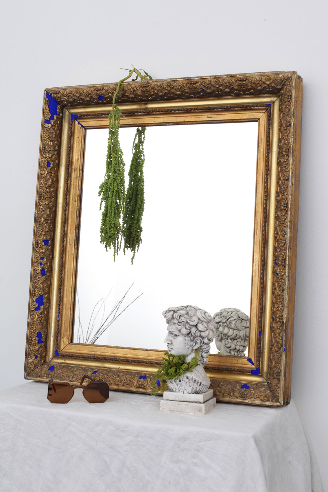 Golden antique mirror with leaf and bright king blue