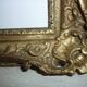 Miroir en bois et stuc redoré de style rocaille 33x29