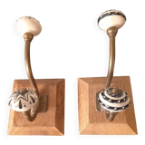 Duo of coat hooks, coat racks in wood and bronze porcelain