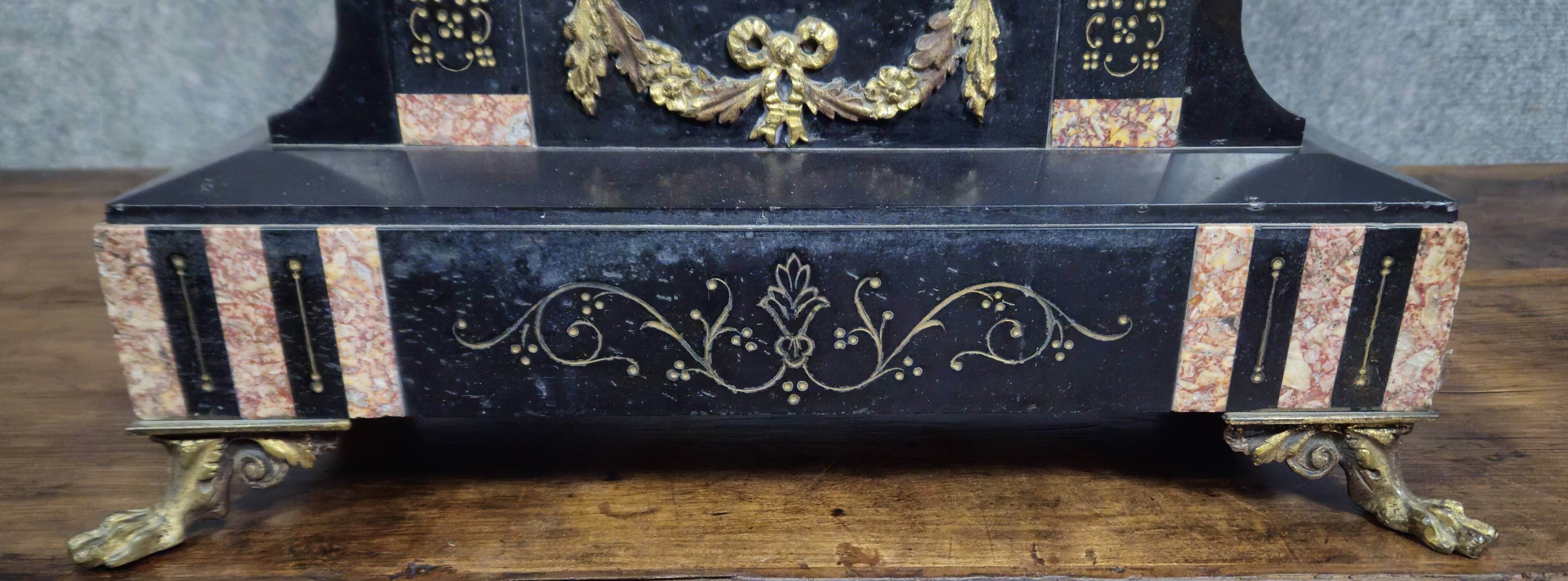 Large notary clock in black marble and gilded bronze.