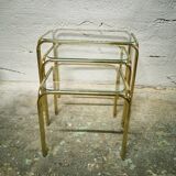 Trio of nesting tables in gold metal