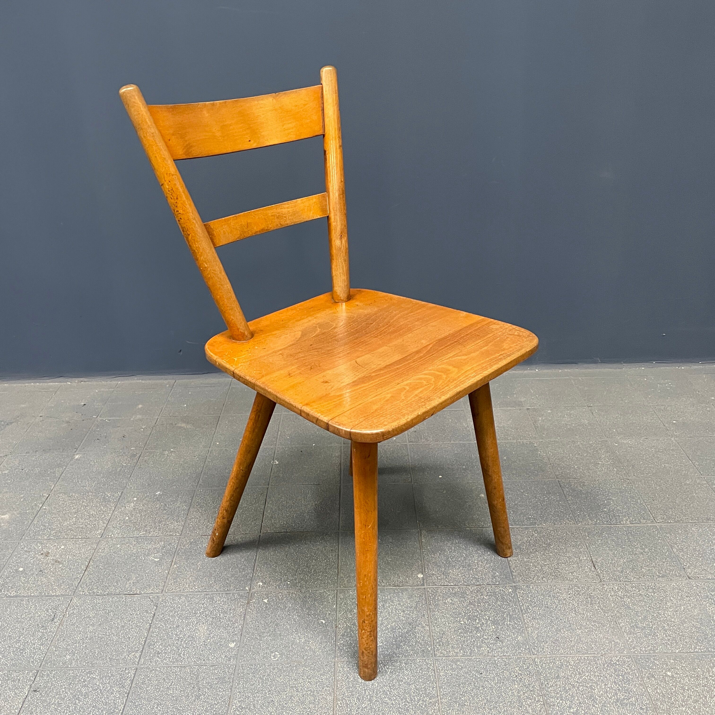 Set of eight german stick chairs from the 1950