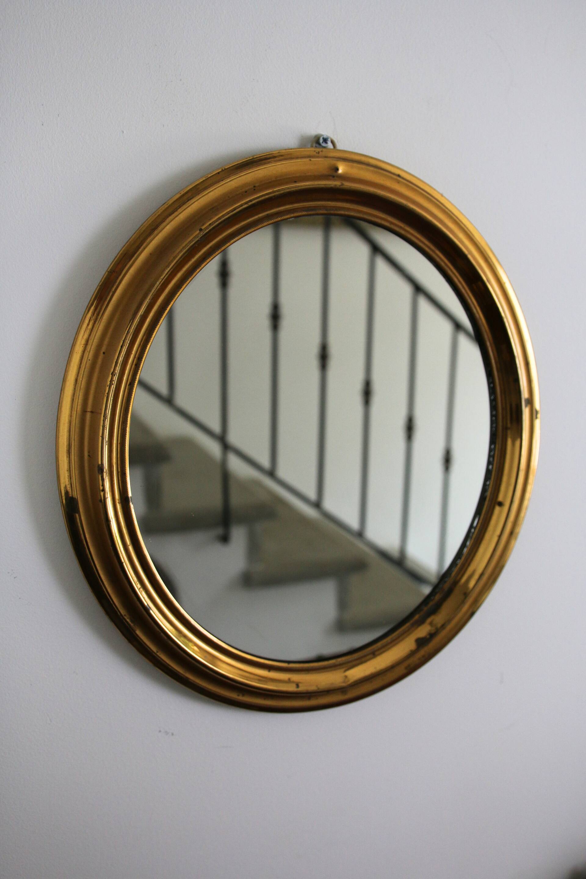 Oval brass mirror