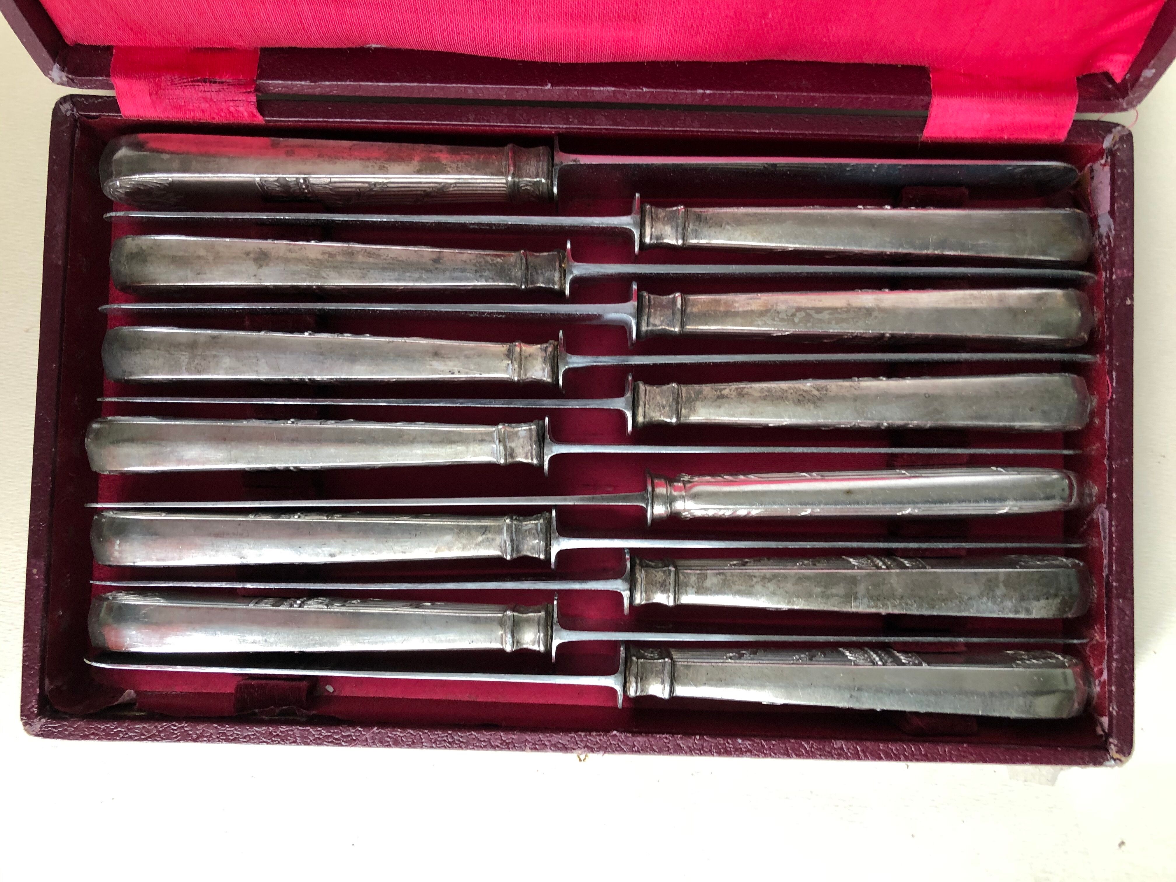 Set of 12 silver metal knives