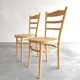 Paire chaises Baumann bois clair et cannage