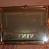 Large beaded mirror in gilded wood from the 60s