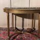 Table guéridon style Louis XVI en bois doré