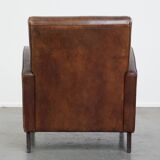 A stately, well-preserved, and comfortable sheepskin armchair