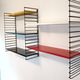 Tomado wall unit with metal shelves by A. Dekker