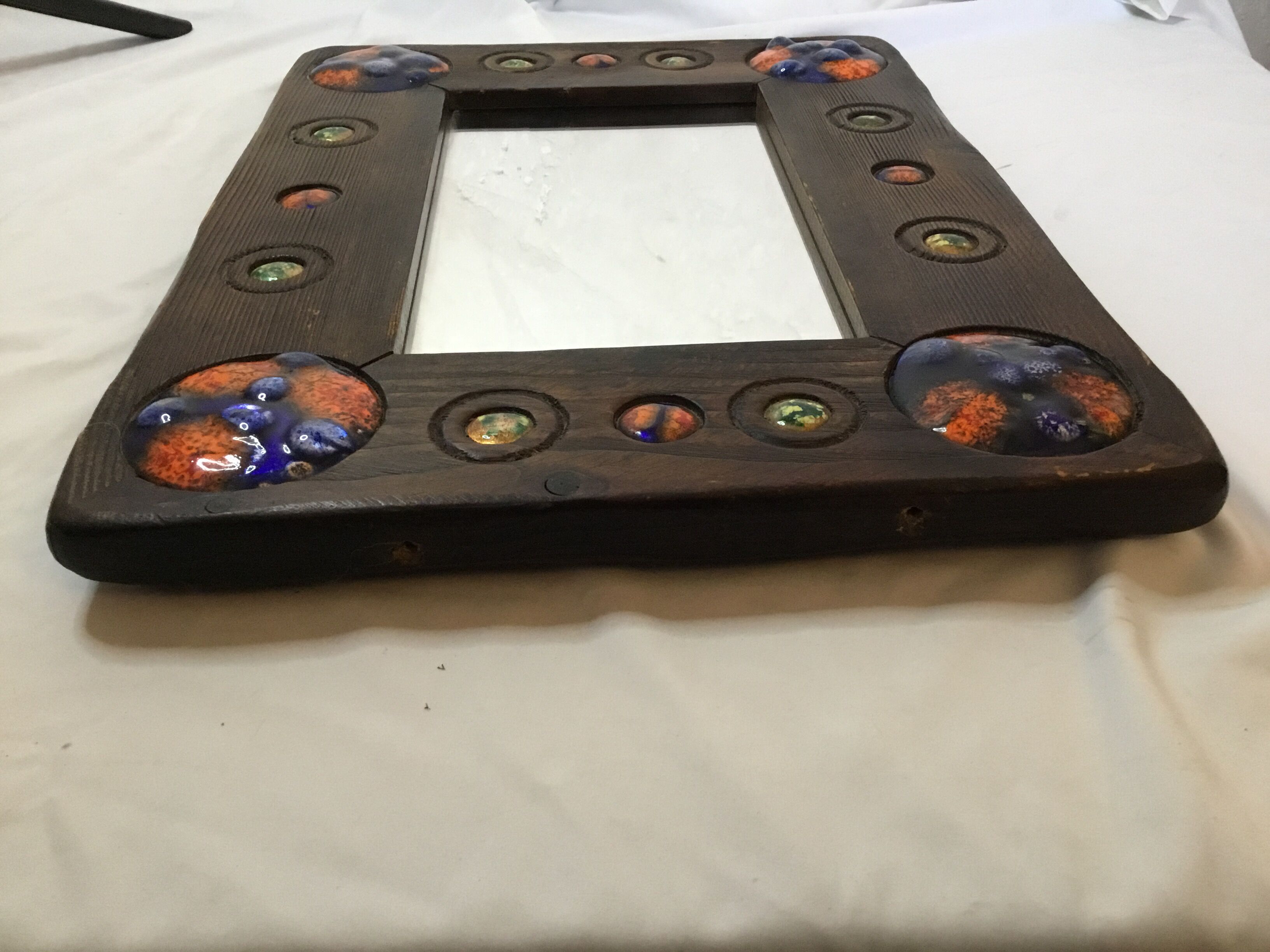 Wooden mirror with copper enamel decoration by Capo Esmaltes (Circa 1960)