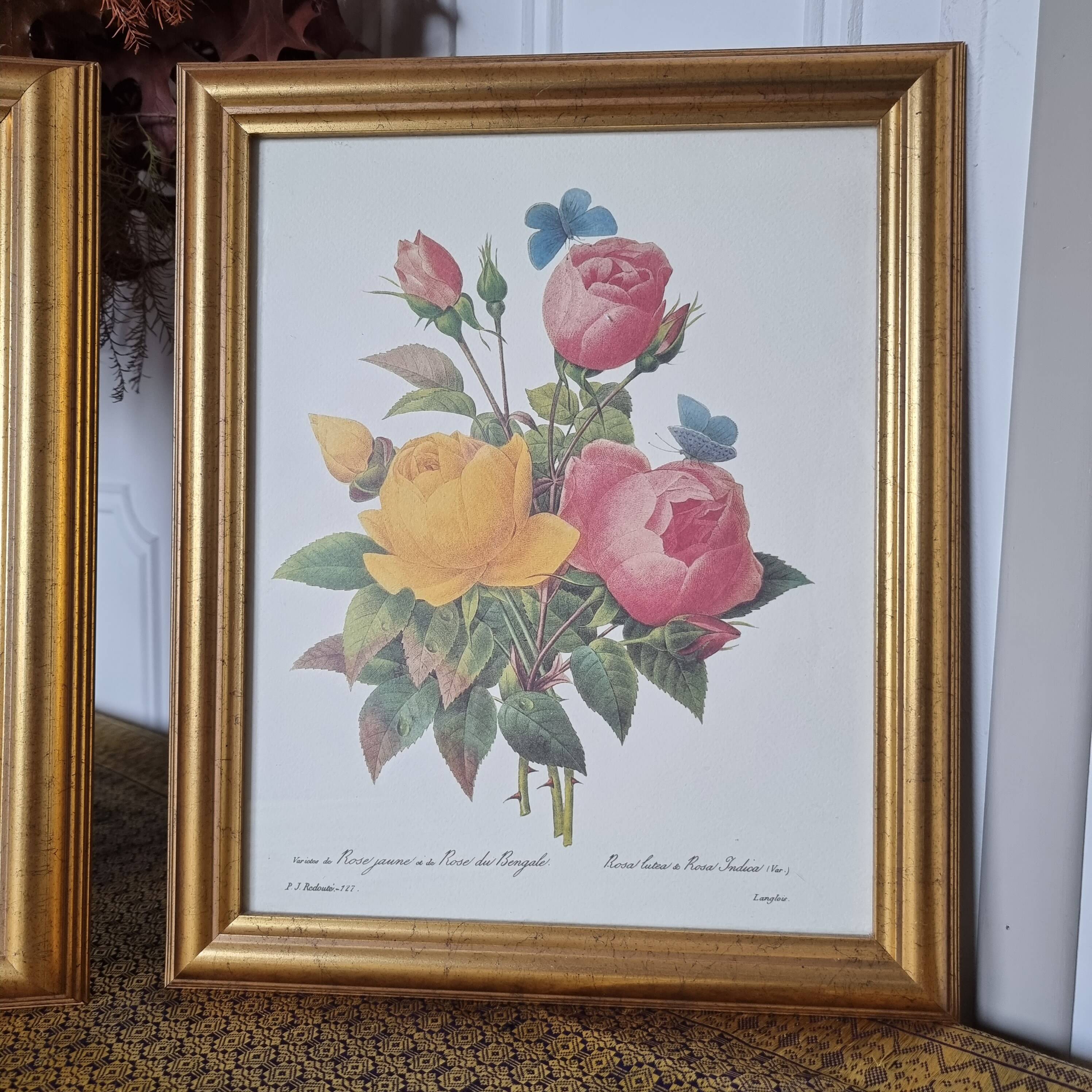 2 paintings with period lithographed flowers and gilded wooden frame.