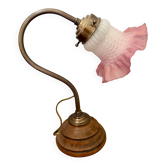 Vintage table lamp made of turned wood and brass with a glass shade.