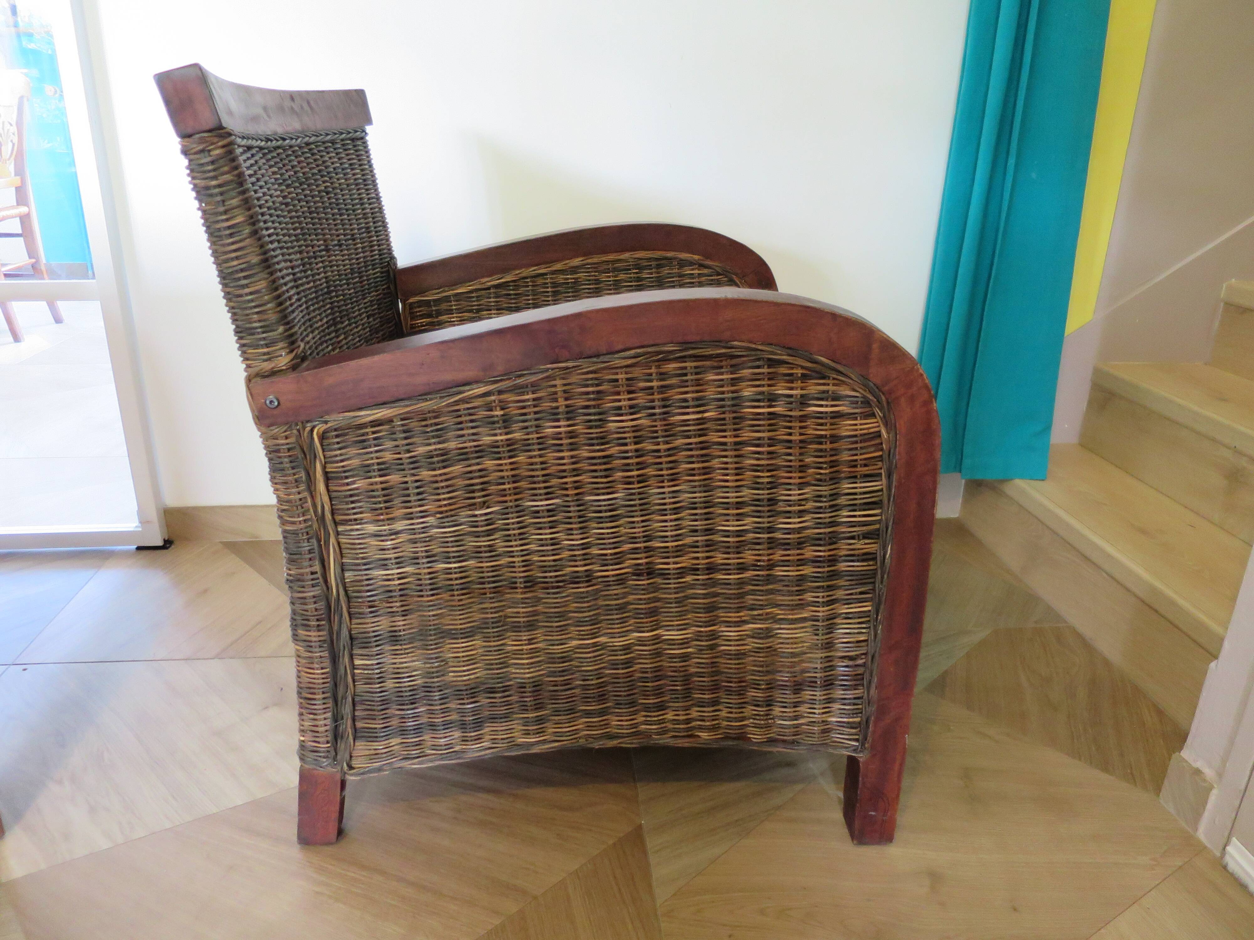 2 colonial-style armchairs in woven rattan and exotic wood