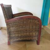 2 colonial-style armchairs in woven rattan and exotic wood