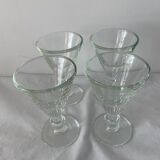 4 glasses of moulded pressed glass wine on foot