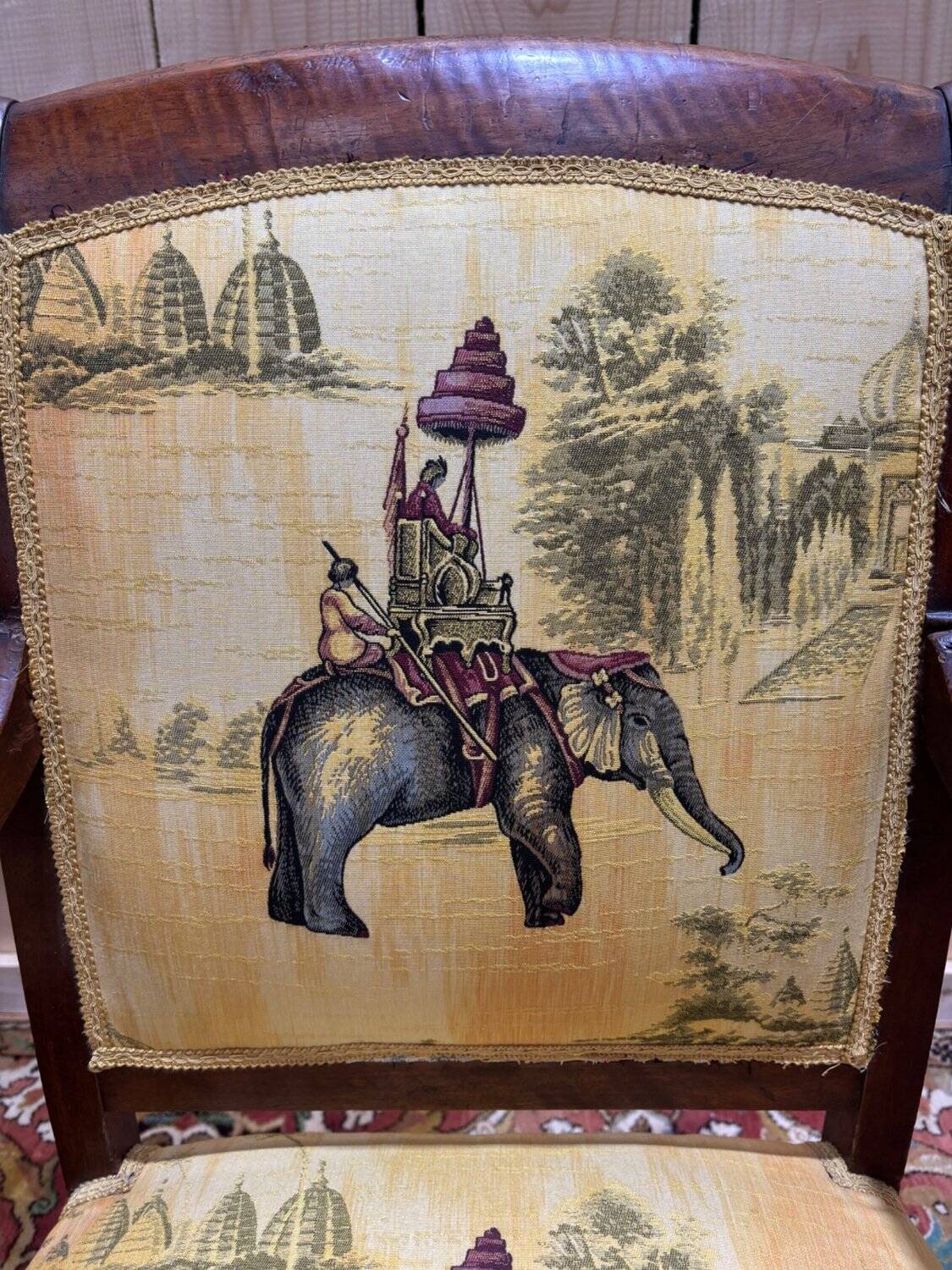 Pair of 19th-century armchairs with a scrolled back