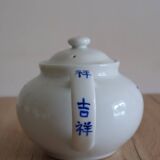 Teapot set and 9 cups with Chinese and French words