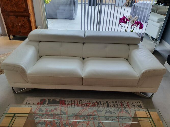 2 white leather sofas