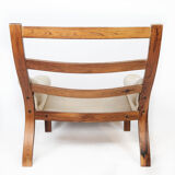 Armchair in rosewood and upholstered with light fabric, of Danish design, 1960s