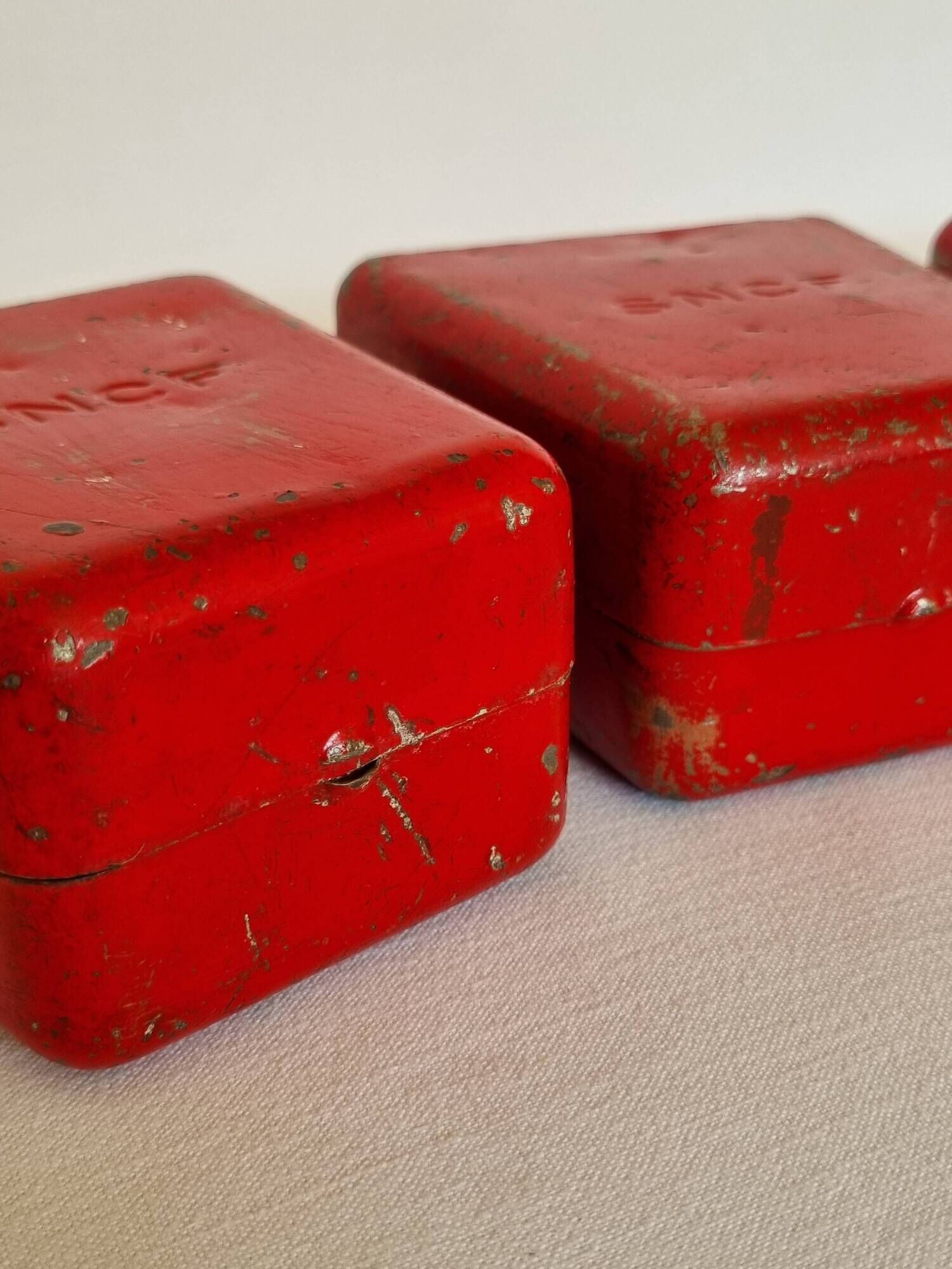 Set of three red painted metal railway boxes with SNCF logo