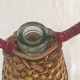 Bottle sheathed on the top and the low d wicker woven