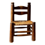 Low fireplace chair attributed to Charles Dudouyt.