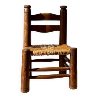 Low fireplace chair attributed to Charles Dudouyt.