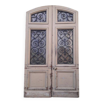 19th century double arched entrance door in oak with grilles and old glass