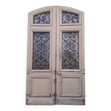 19th century double arched entrance door in oak with grilles and old glass