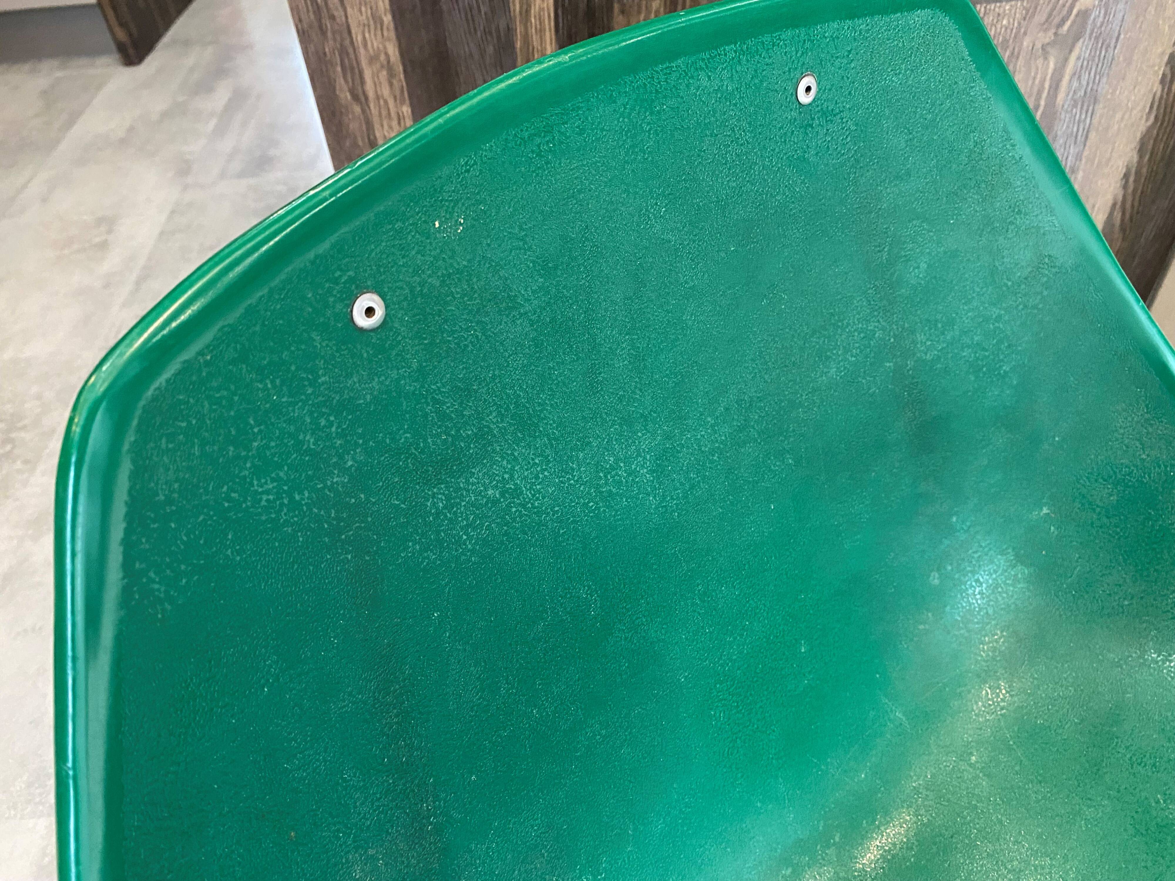 A shell chair by Pierre Guariche for Meurop in vintage green from the 1960s.