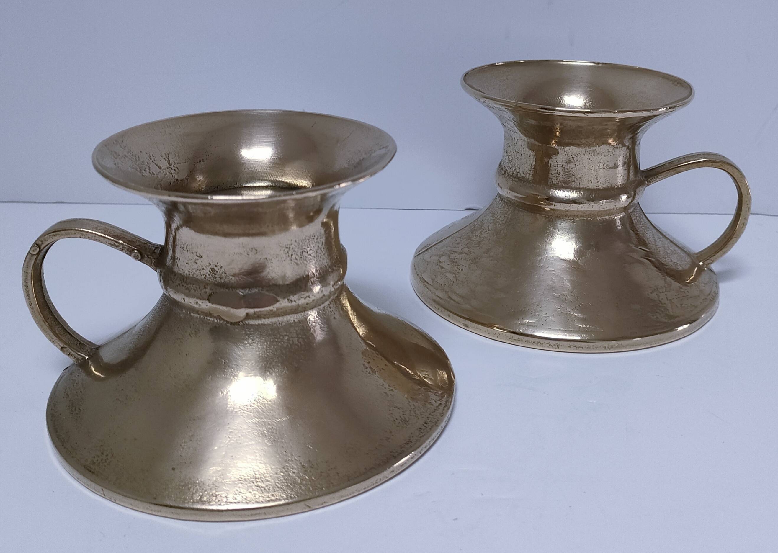 Pair of vintage solid brass hand candlesticks
