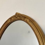 Oval mirror in carved wood